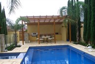 View of pool and covered outdoor entertaining