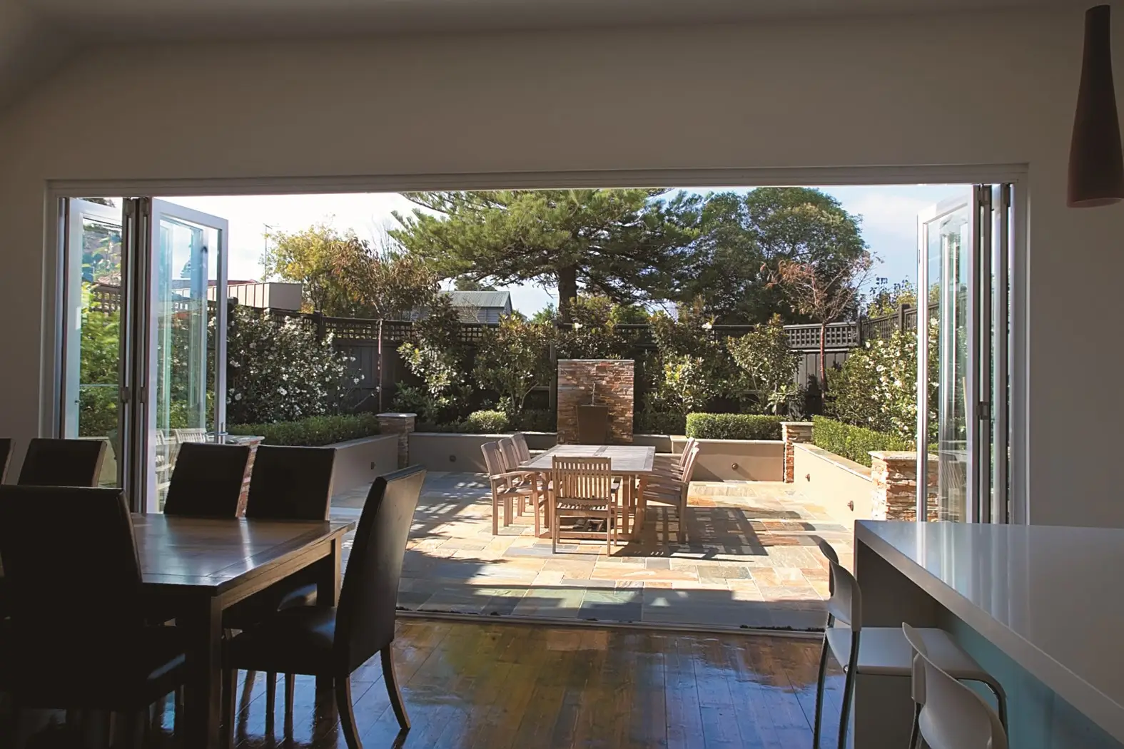 Courtyard garden opening out from interior dining