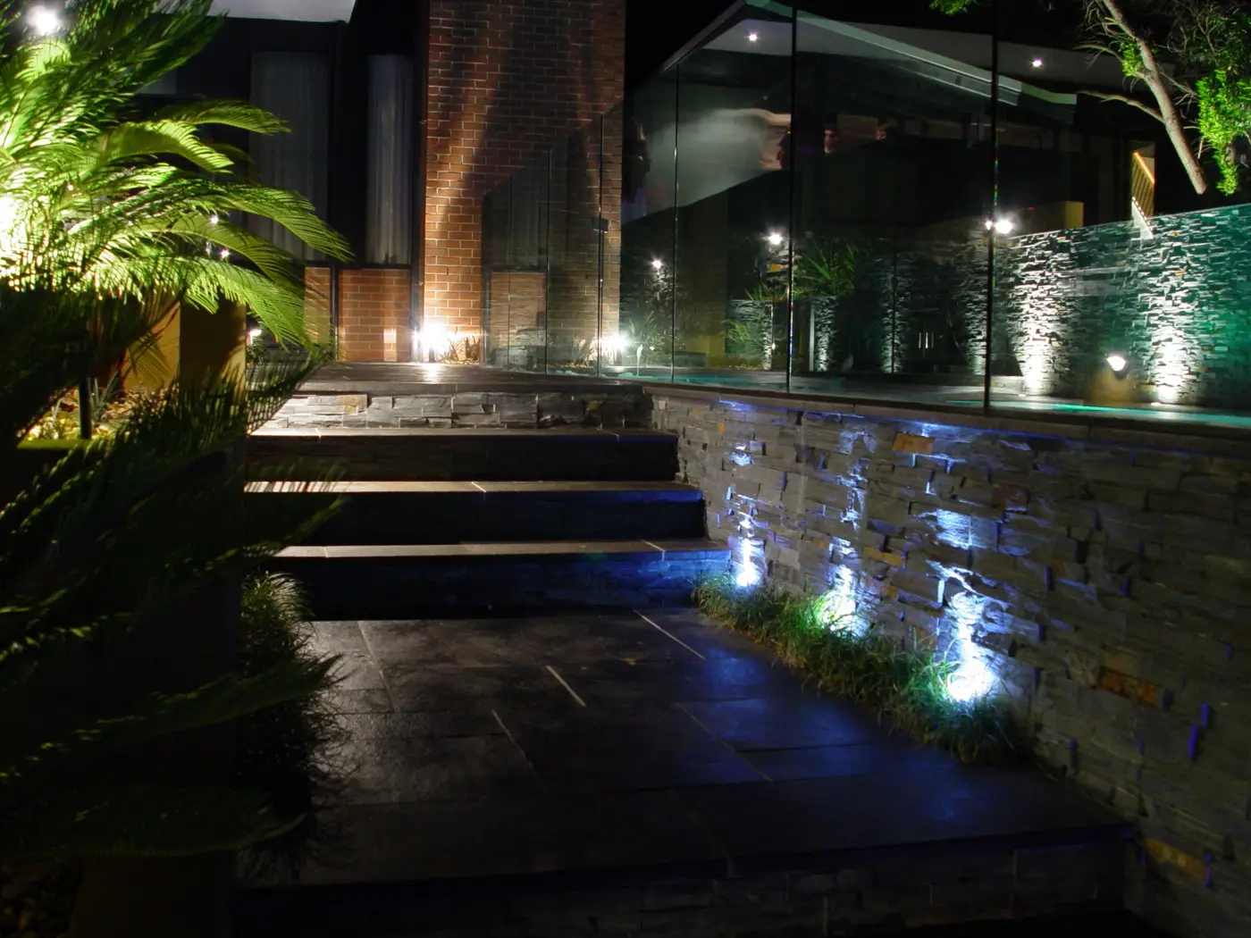 View of steps and planter boxes at night