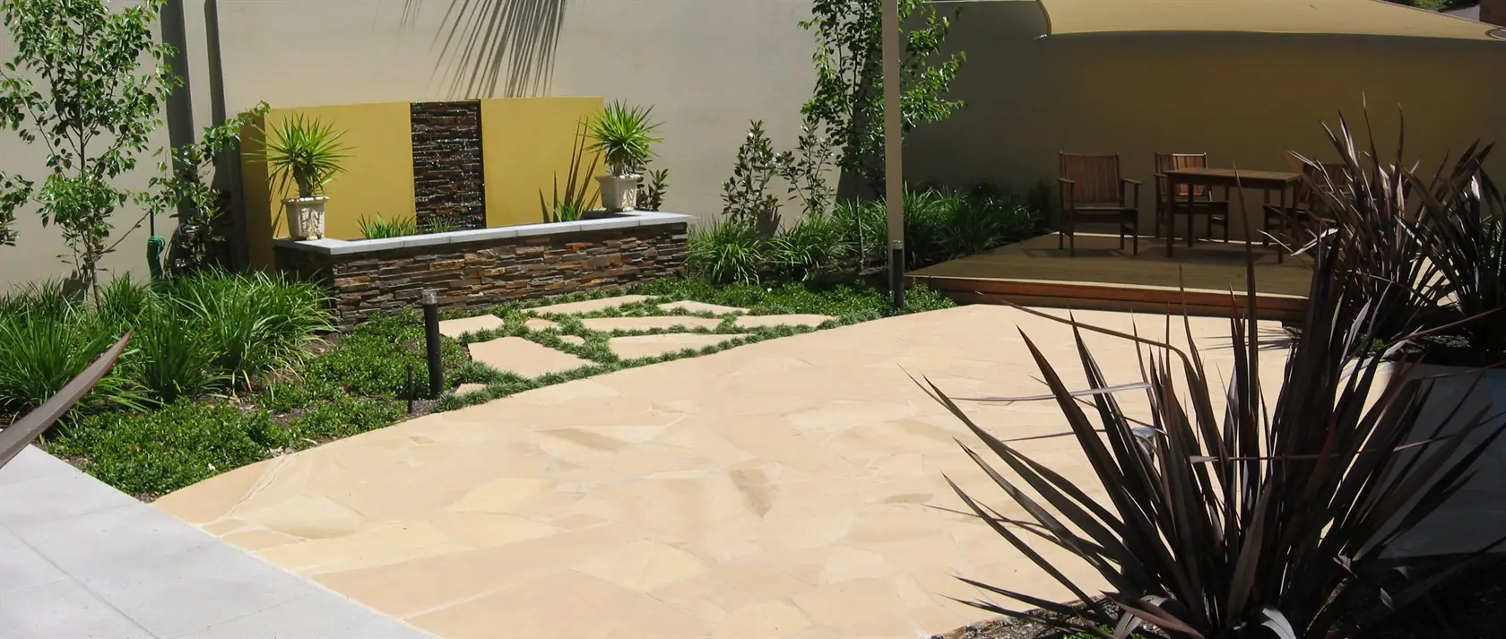 Waterfeature and entertaining deck