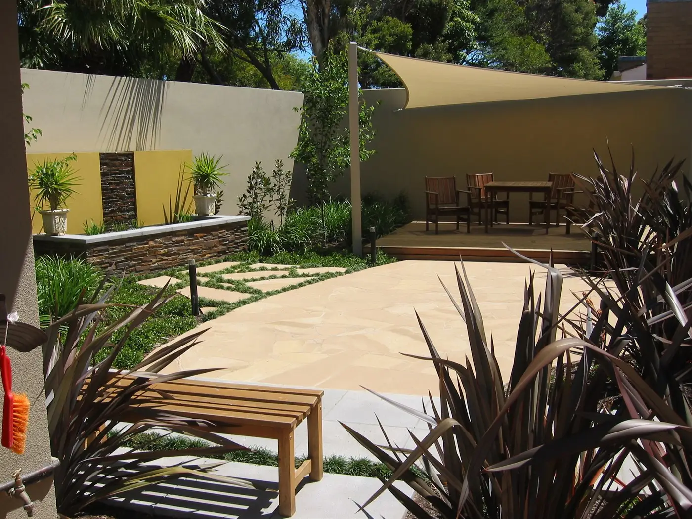 Deck with Shadesail and Sandstone Paving